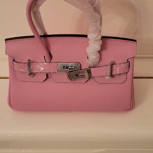 Gorgeous pink handbag! Isn't she lovely! Never used. So cute! No brand.